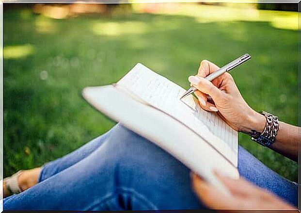 woman writing in notebook