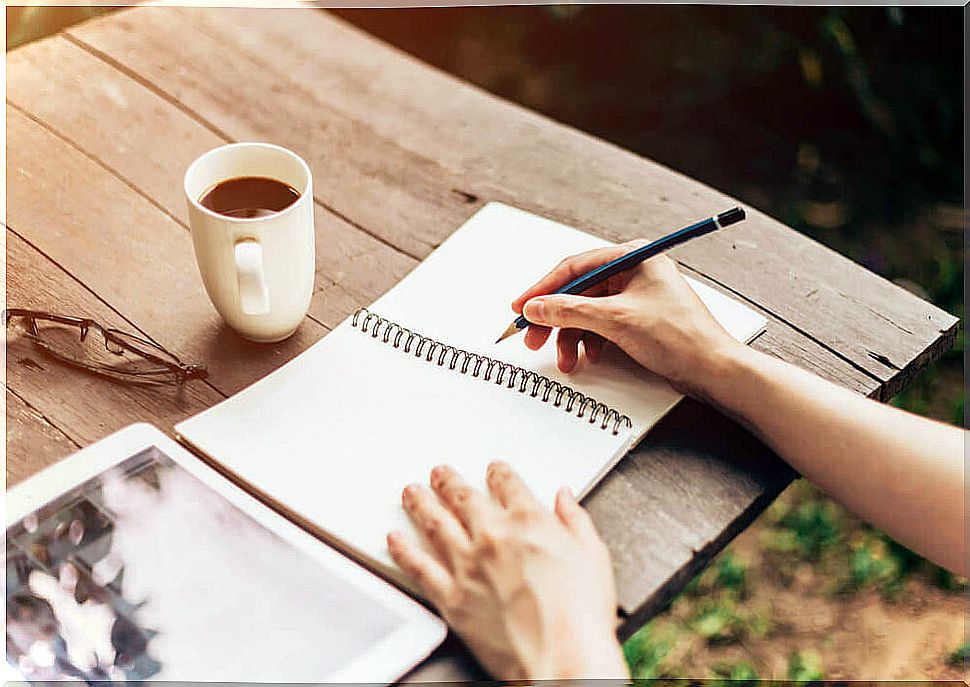 woman writing in notebook