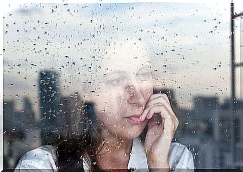 woman-looking-out-the-window-with-anxiety