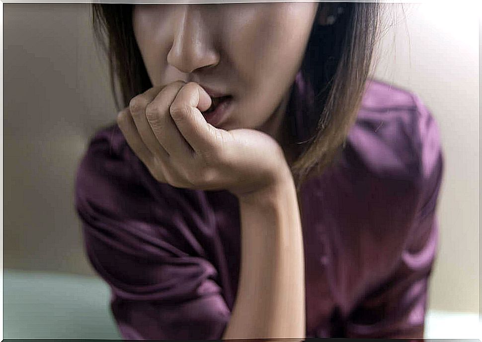 nervous woman biting her nails