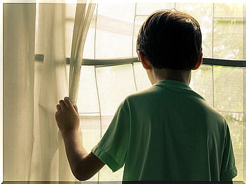 boy looking out the window