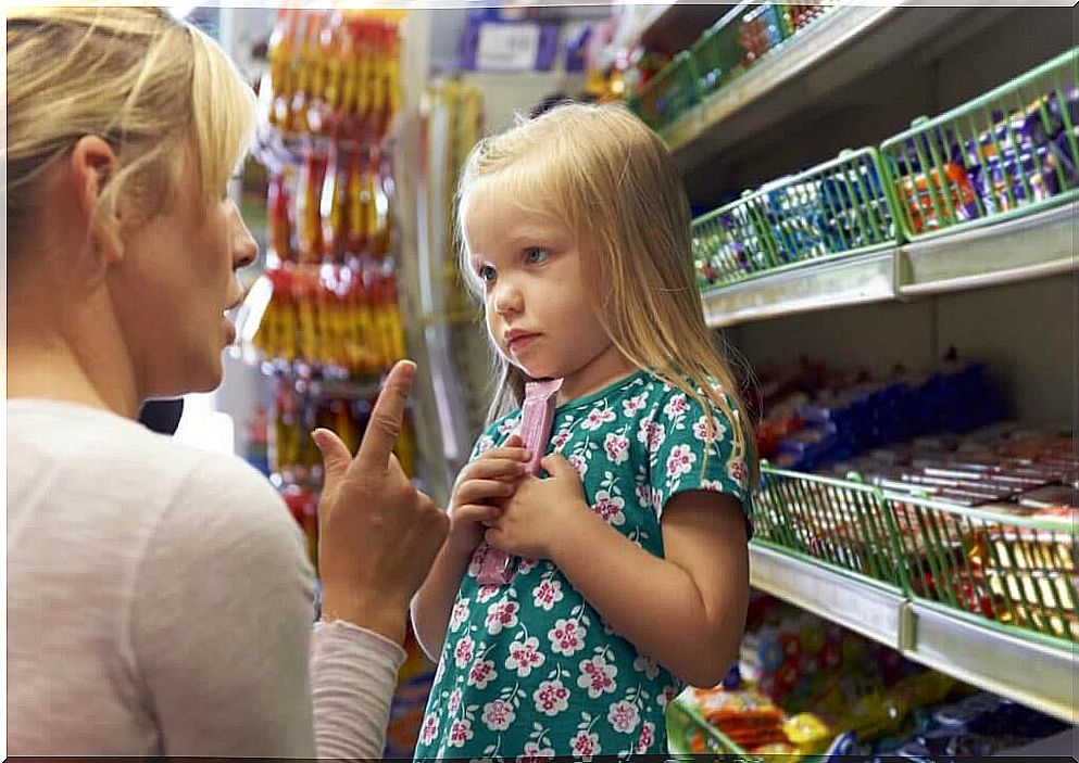 mother scolding her daughter at the market