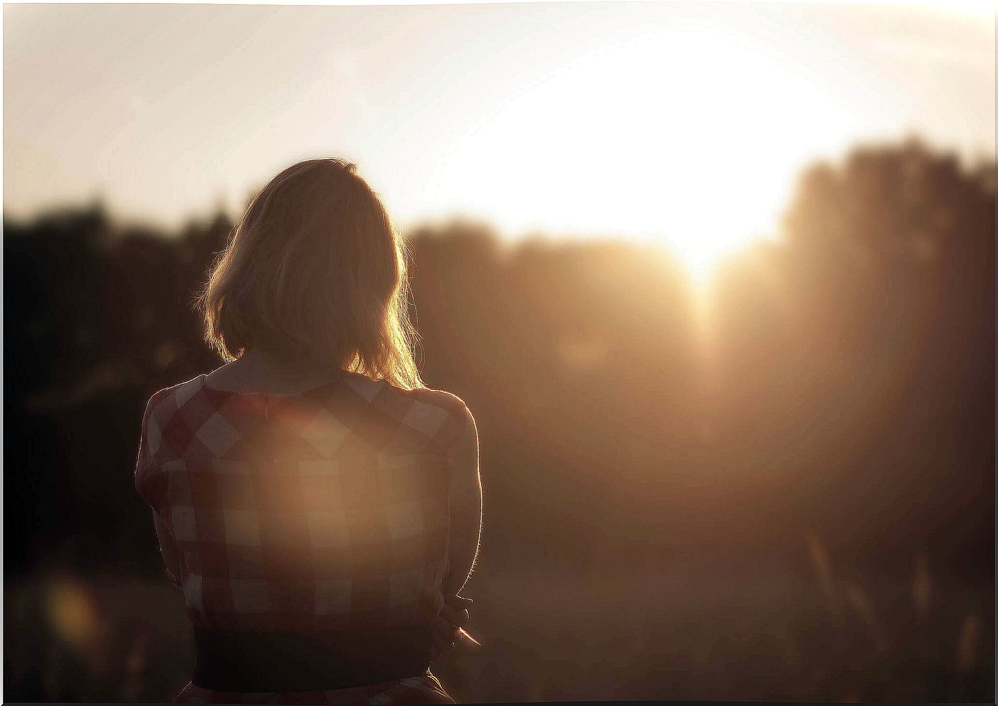 woman watching sunset