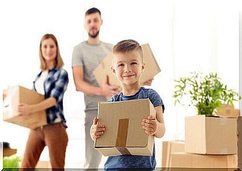 boy helping to move house