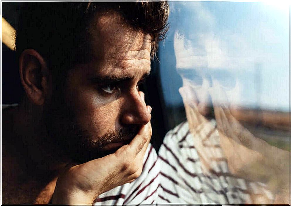 thoughtful man in train window