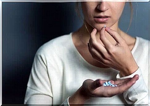 woman taking pills