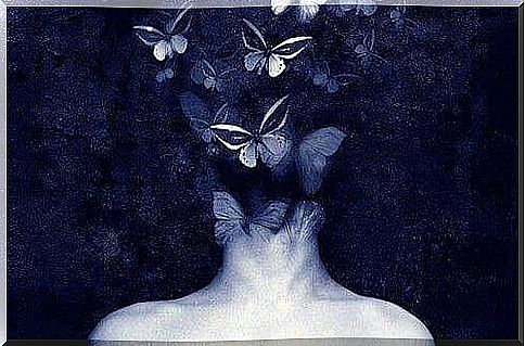 woman with butterflies in her hair