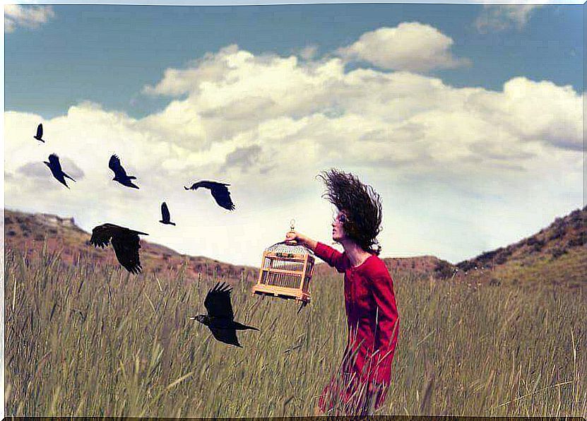 woman releasing birds