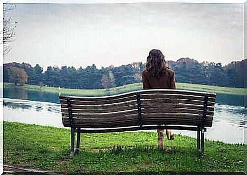 woman in front of a lake